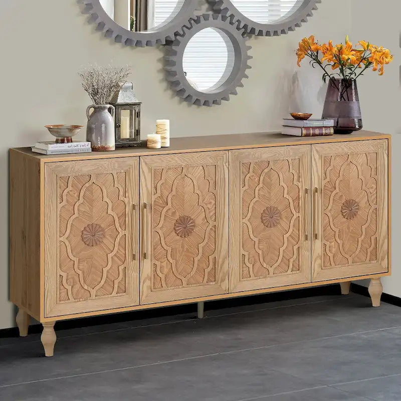 Grand meuble de rangement avec portes sculptées motif floral et poignées en métal, idéal pour le salon, la cuisine ou l'entrée.